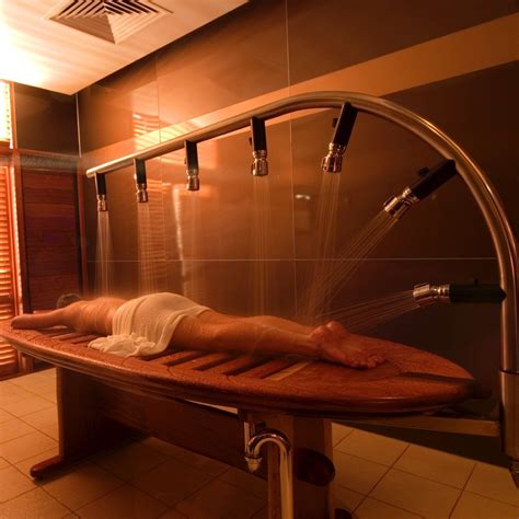 You can have a body wrap or salt scrub and you are on a <b>table</b> with a small pipe surrounding you from above. . Massage table shower